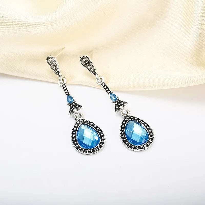 Silver earring blue rhinestone