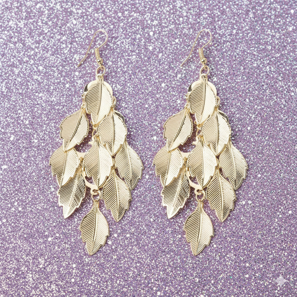 gold earrings on sparkly background