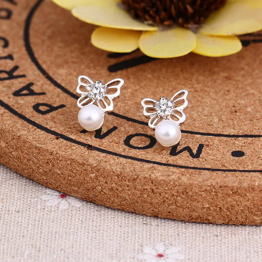 Silver butterfly white pearl earring