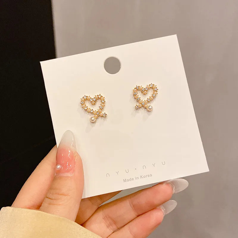 Gold heart cross  pearly earring